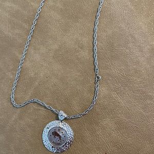 Silver colored Taurus the bull zodiac medallion necklace,gently used